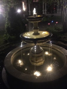 karbelle mansion fountain at night with lights
